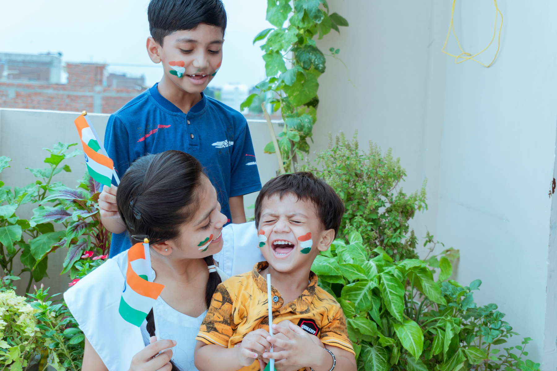 indian children holding national Indian flag with pride